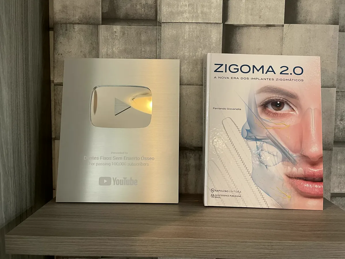 YouTube 100k-subscriber plaque next to the Zygoma 2.0 book